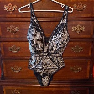 Becca cutout one piece swimsuit in a size large.